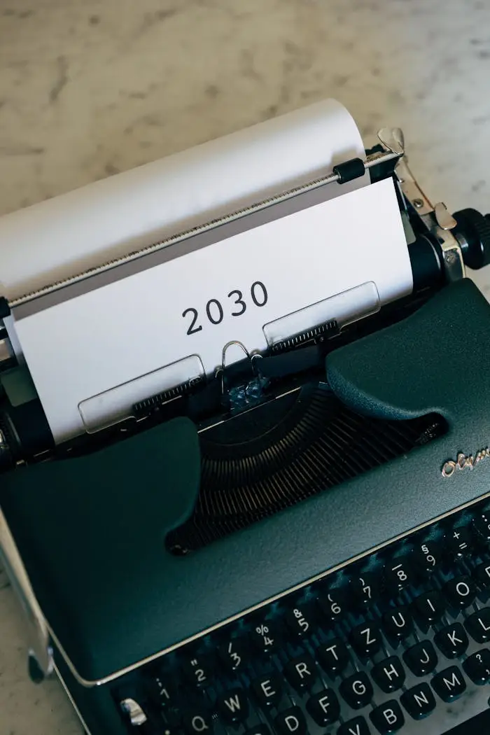 Close-up of a vintage typewriter typing the year 2030 on paper. Classic design.